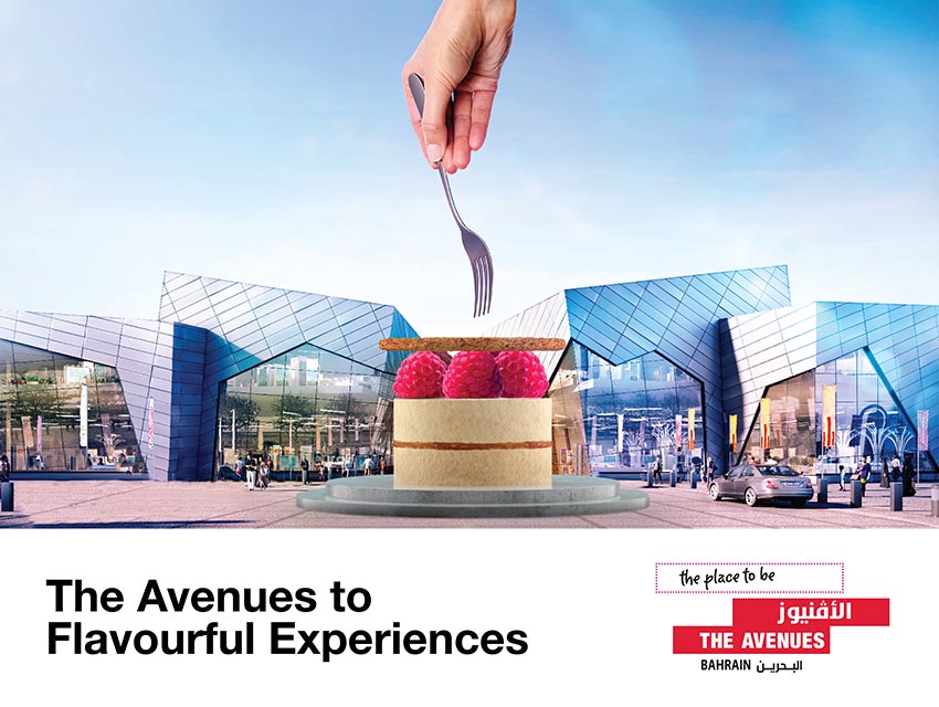 The Avenues Bahrain: “The Avenues to Flavourful Experiences” mega-com, a fork reaching for a raspberry cake set in the mall entrance, creative direction by Bashar Daas