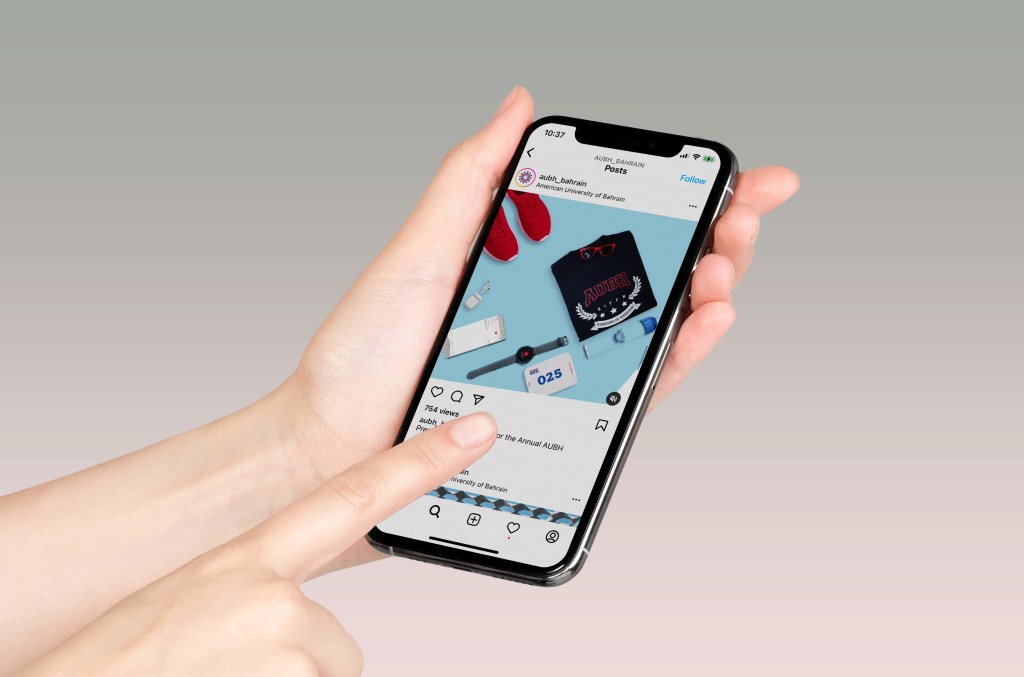 AUBH: the university’s Instagram feed on a phone held in hand, creative direction by Bashar Daas
