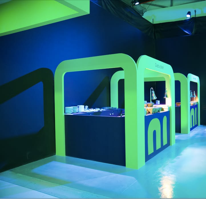 ila Bank: green arches shaped like the rounded ila logo, creative direction by Bashar Daas
